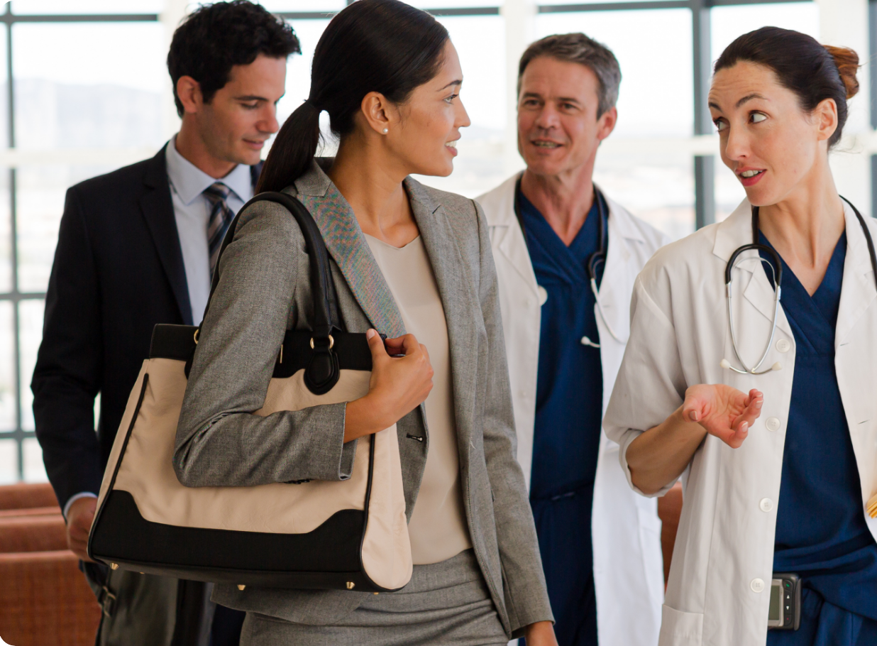 Pharmacist standing with a digital tablet, smiling